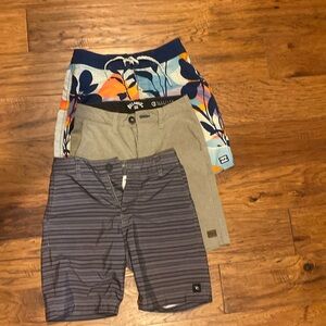 3 pairs of shorts- Size 23- one boardshort and two walking shorts.